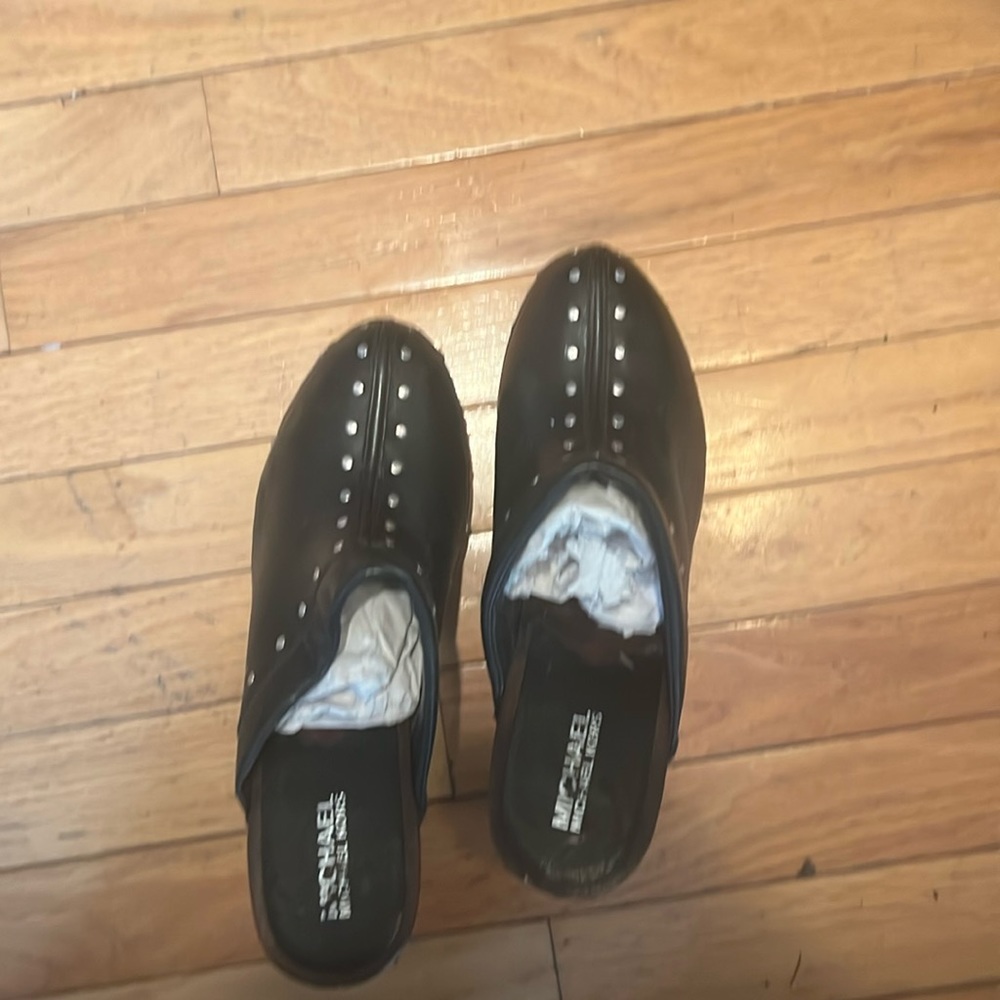 Black, stylish Michael Kors clogs